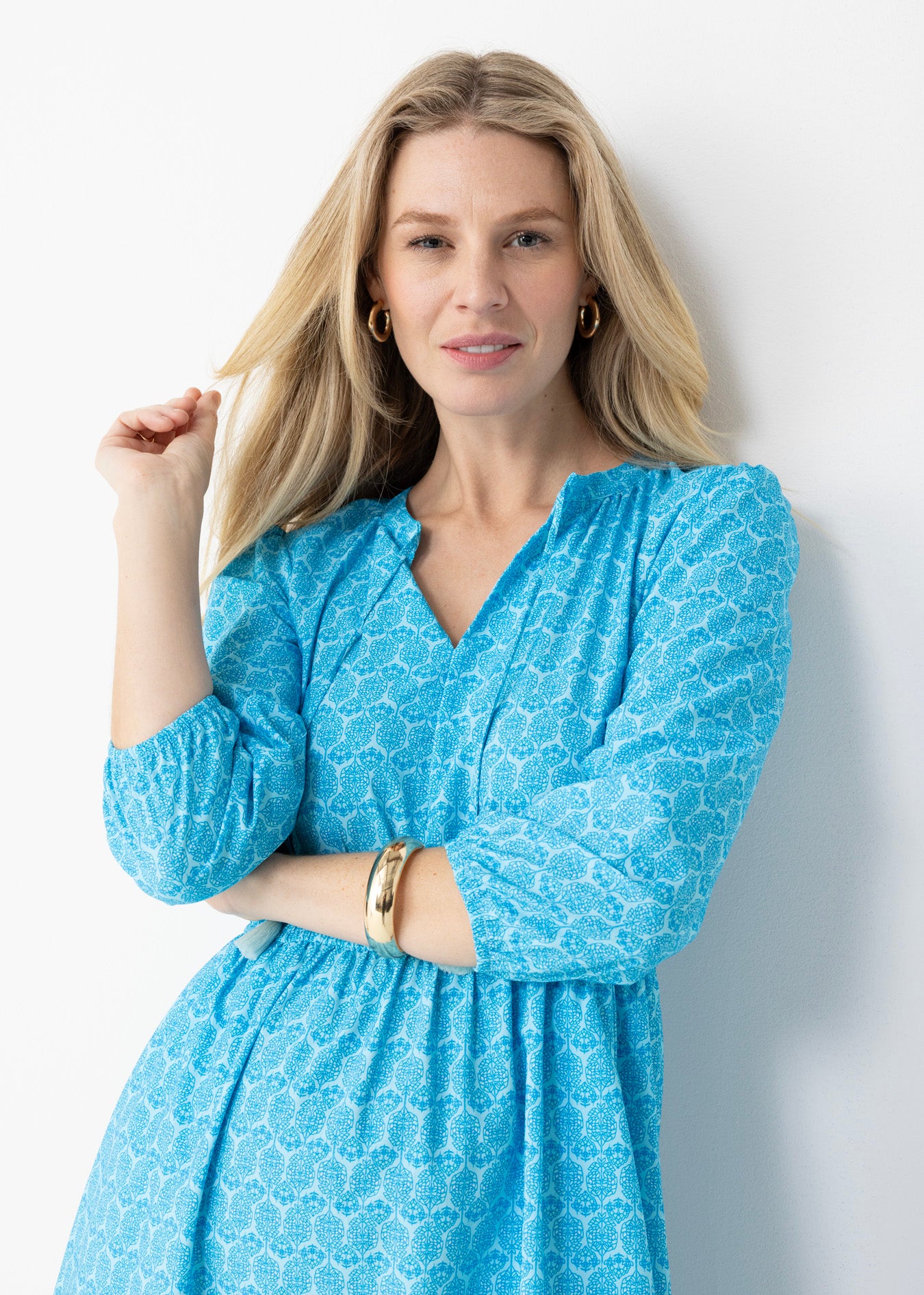 Close up of a blonde woman wearing Rosemary Beach Relaxed Maxi Dress in a studio.