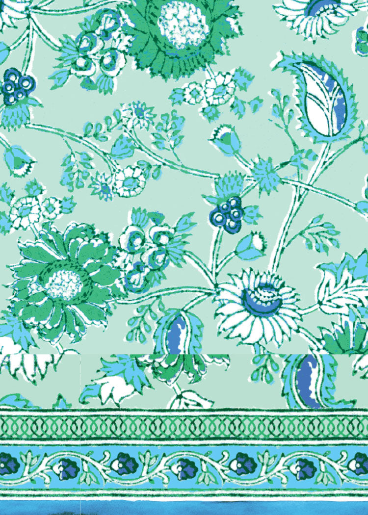Decorative fabric with floral and paisley patterns on a green background