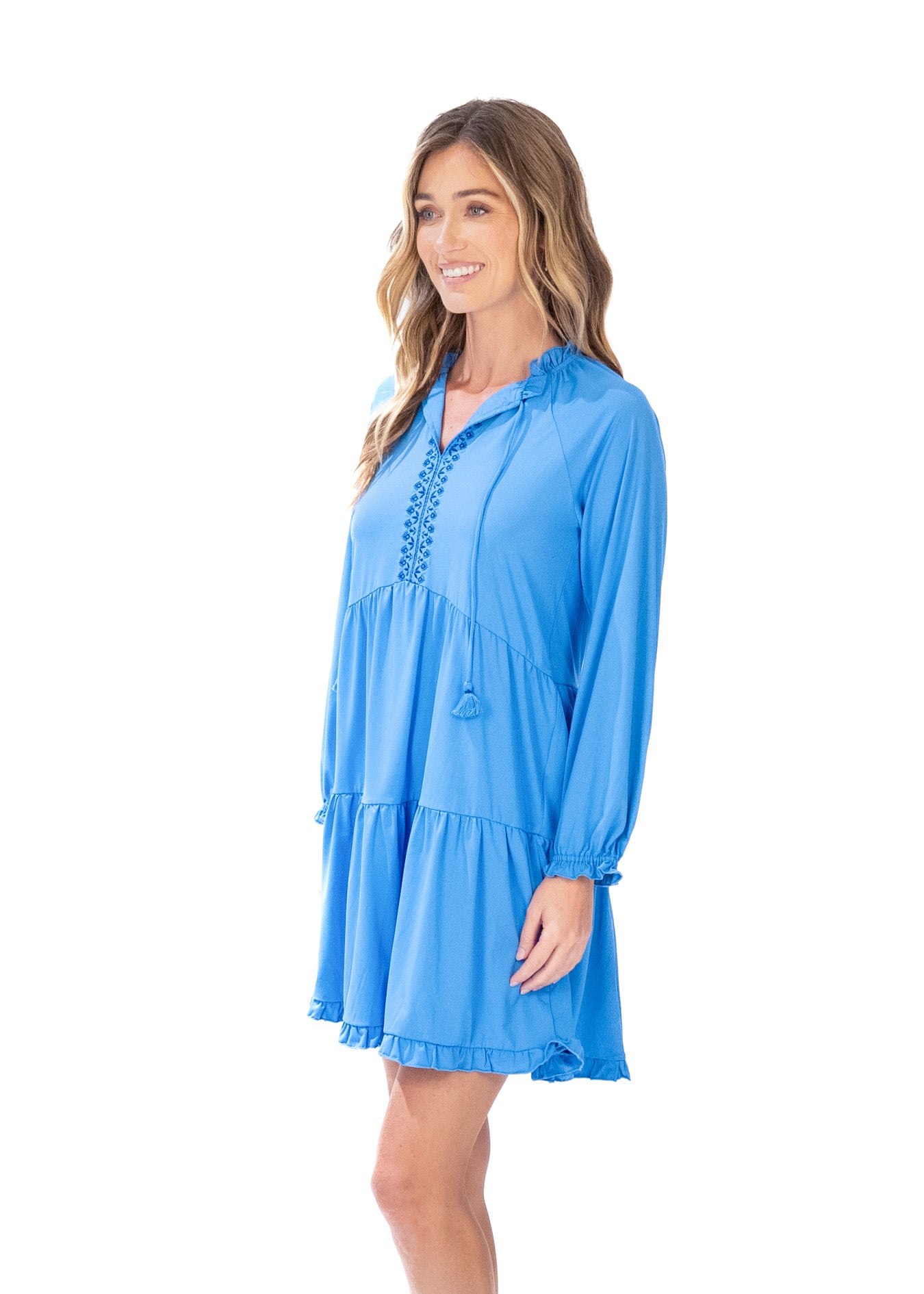 Side facing blonde woman wearing the Periwinkle Blue Embroidered Tiered Dress.