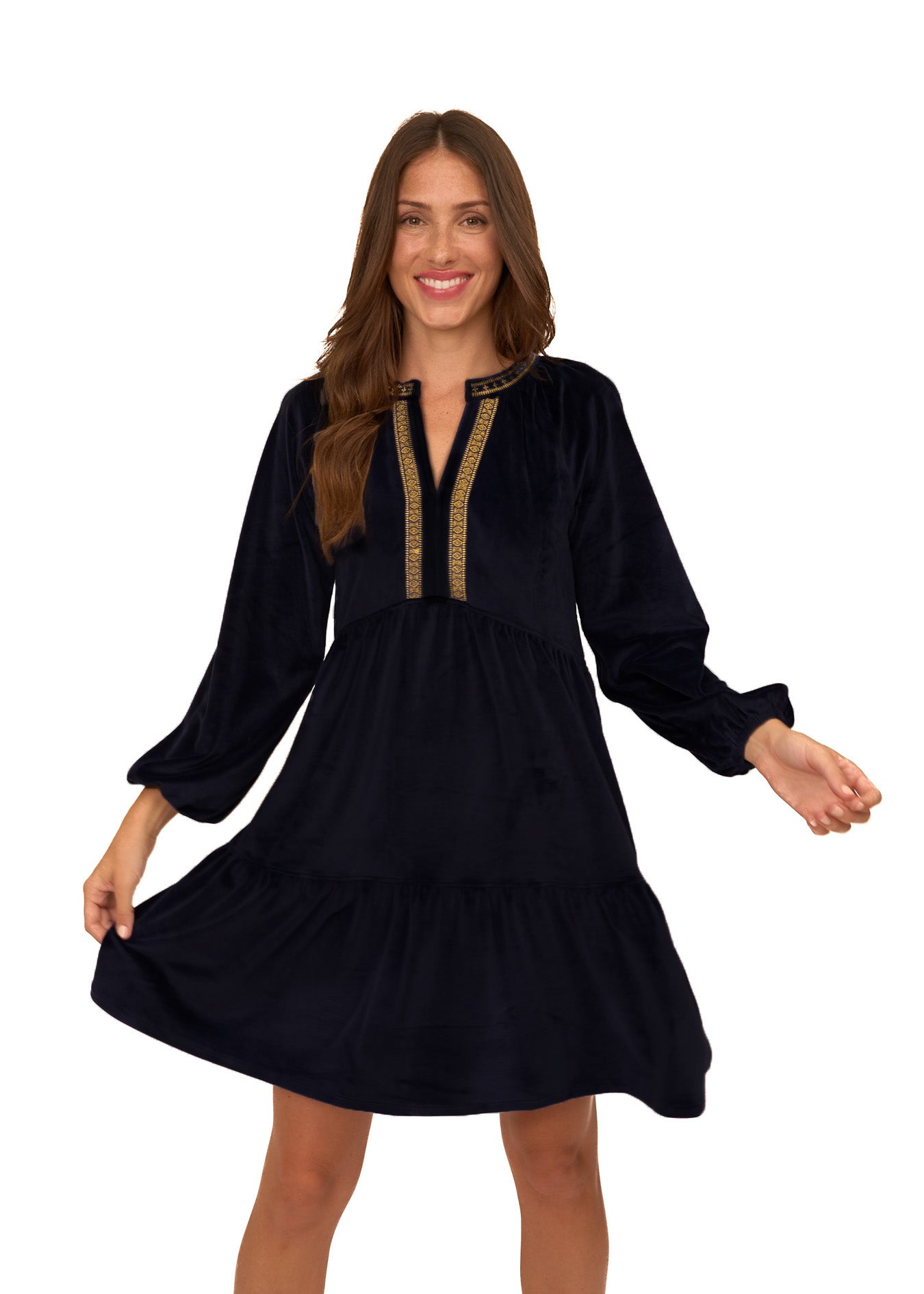 Brunette woman holding the bottom of her Cabana Life sun protective Black Embroidered Velvet Tiered Dress on a white background.