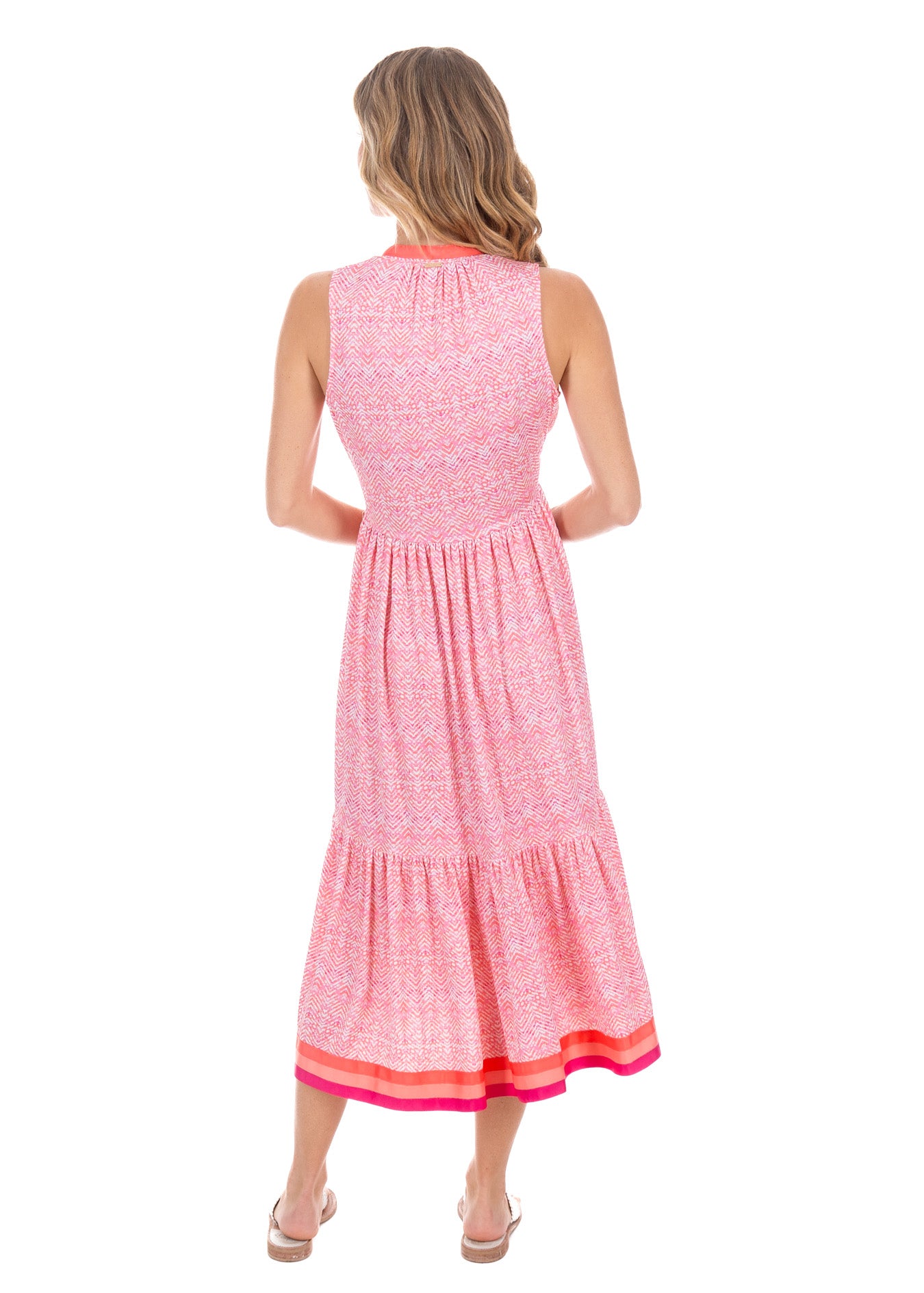 Blonde woman wearing the Algarve Midi Dress, showing the back of the garment.