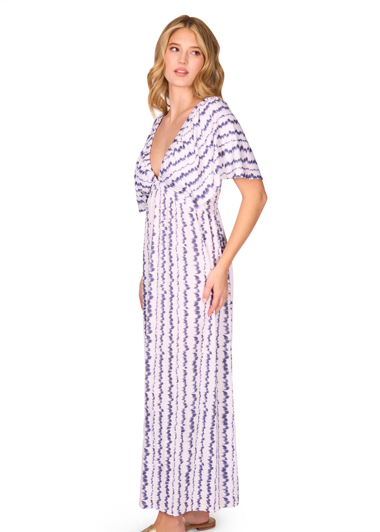 Side of woman wearing San Sebastian Flutter Sleeve Maxi Dress
