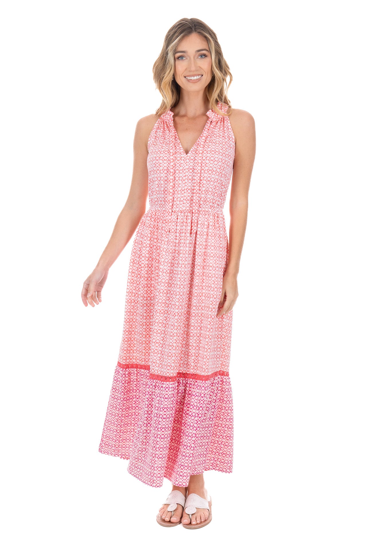 Front facing blonde model wearing the Algarve Tie Neck Maxi Dress with white sandals.