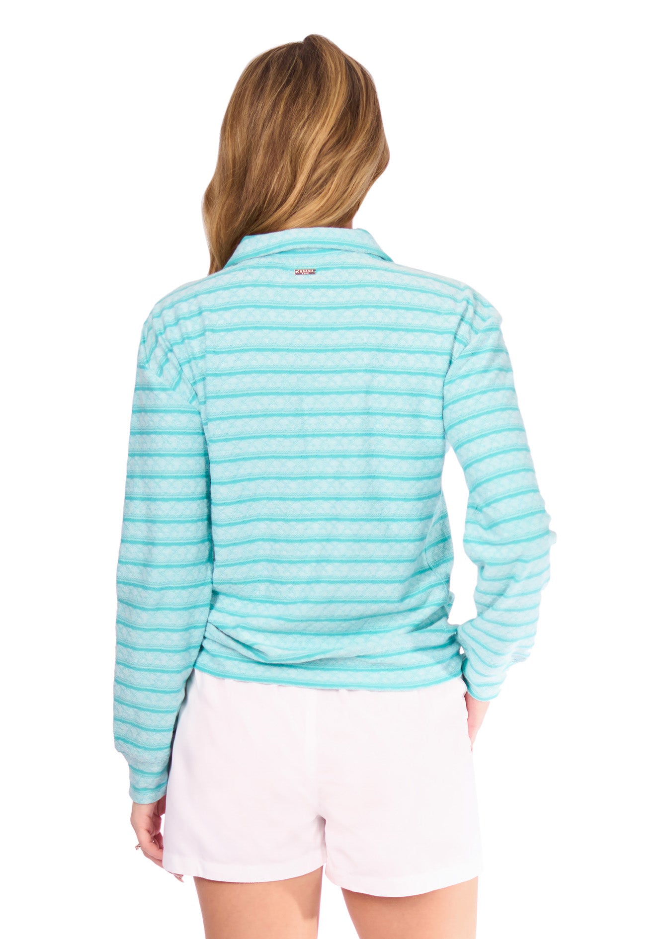 Back of woman in Aqua Half Zip Pullover and white shorts
