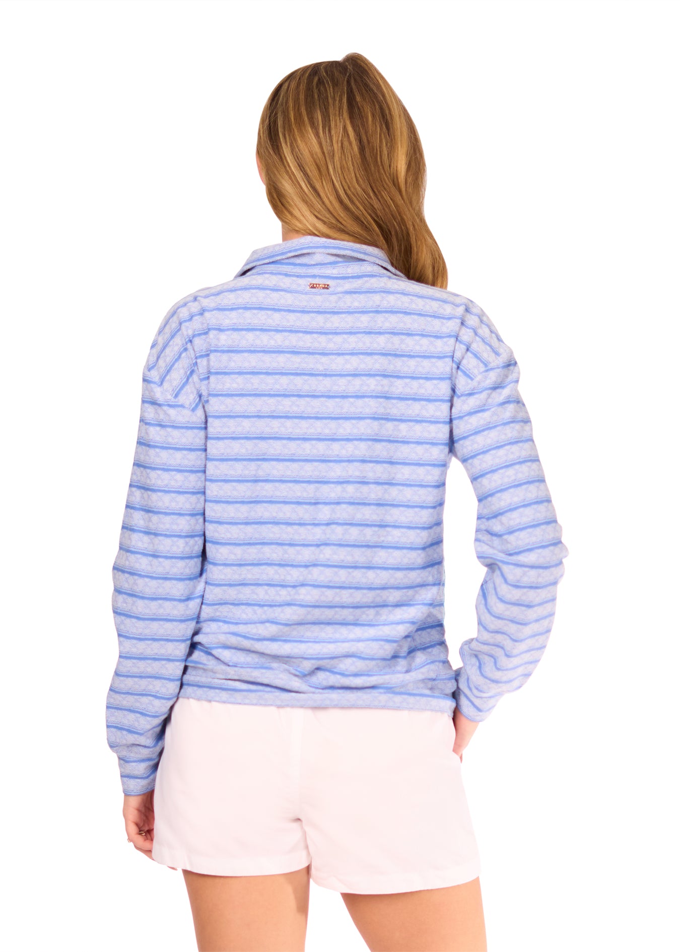 Back of Woman in Blue Half Zip Pullover and White Microfiber Shorts