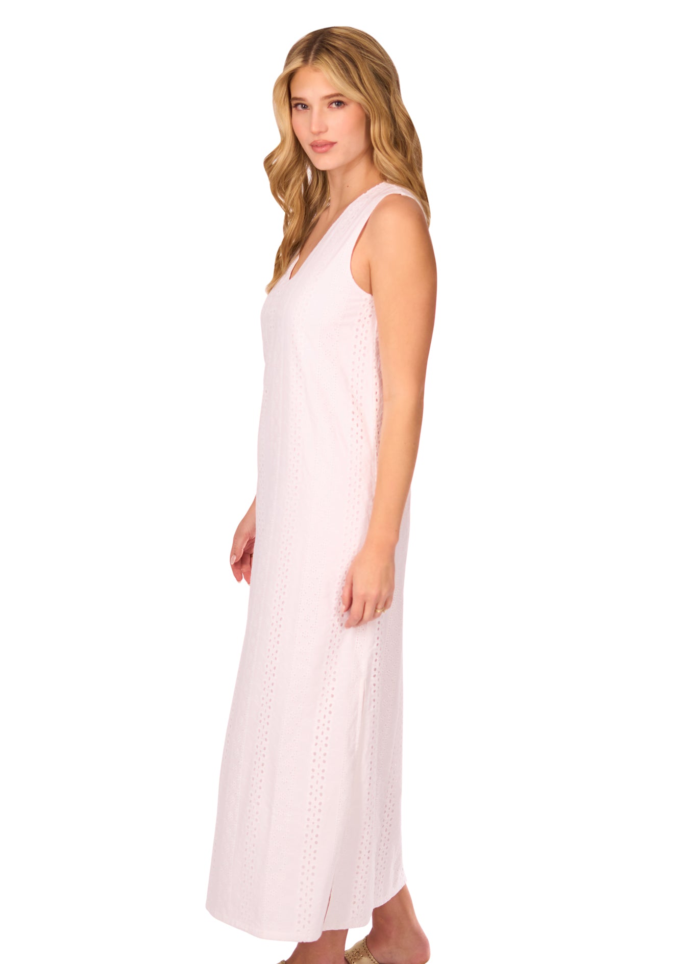 The side of a blonde woman wearing the White Eyelet Side Slit Maxi Dress on a white background.
