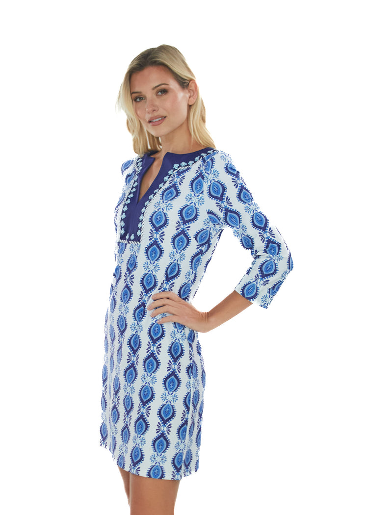 Blonde woman wearing San Sebastian Embroidered Tunic Dress posing with hand on hip.