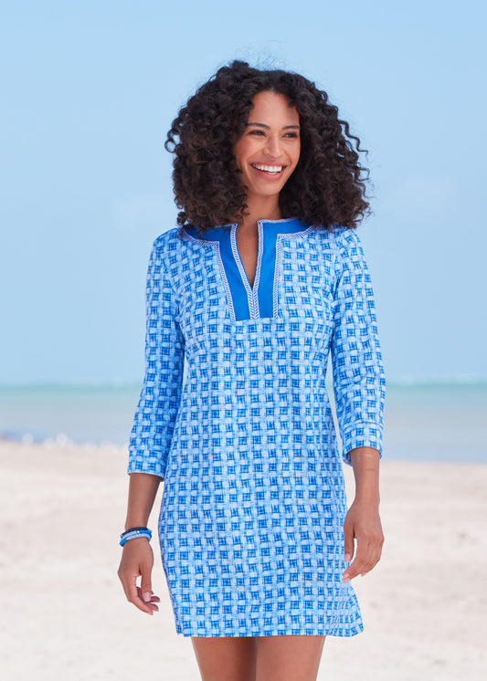 Black woman wearing Windermere Embroidered Tunic Dress on beach.