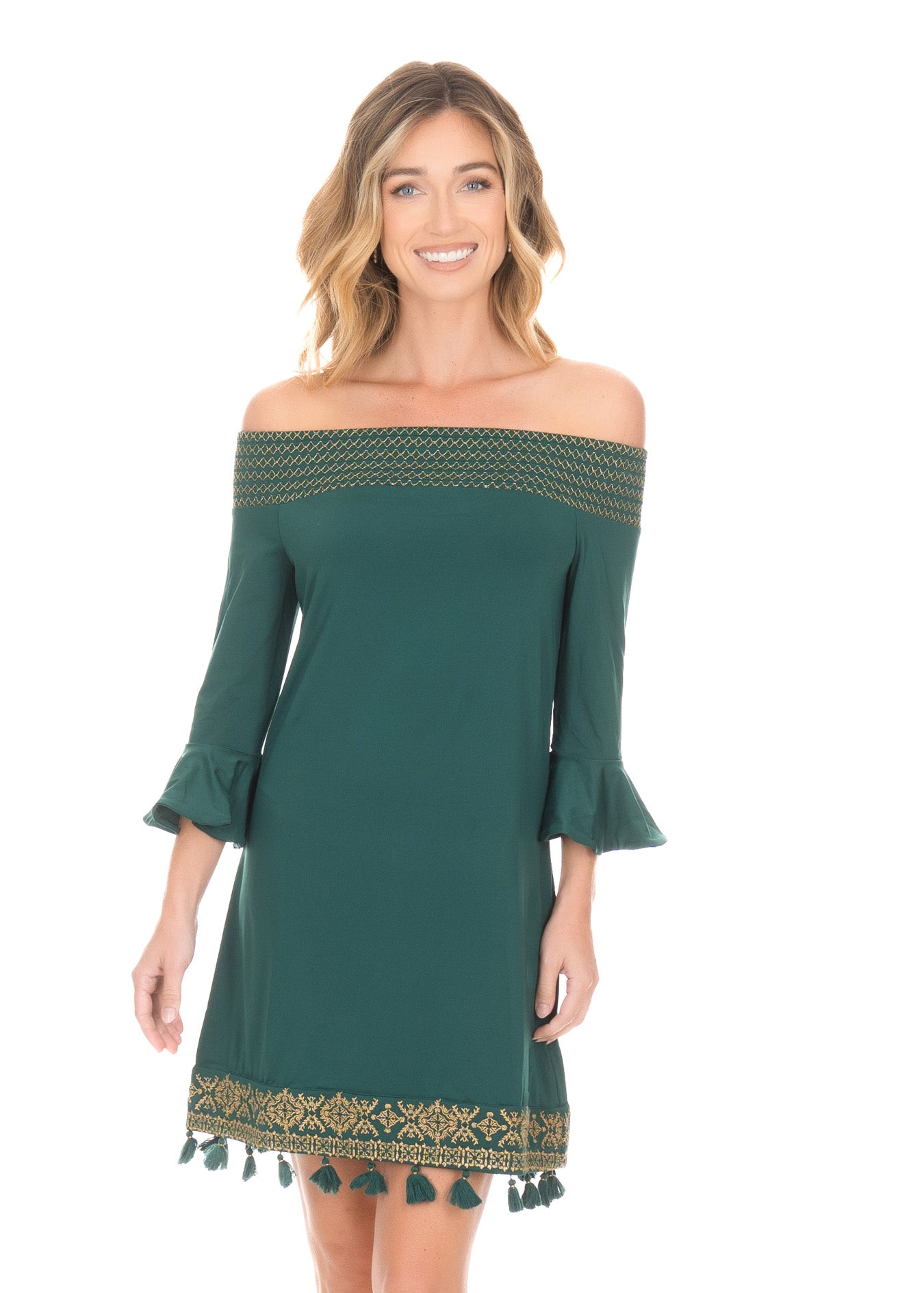 Front facing blonde woman wearing the Emerald Metallic Embroidered Off The Shoulder Dress while smiling.