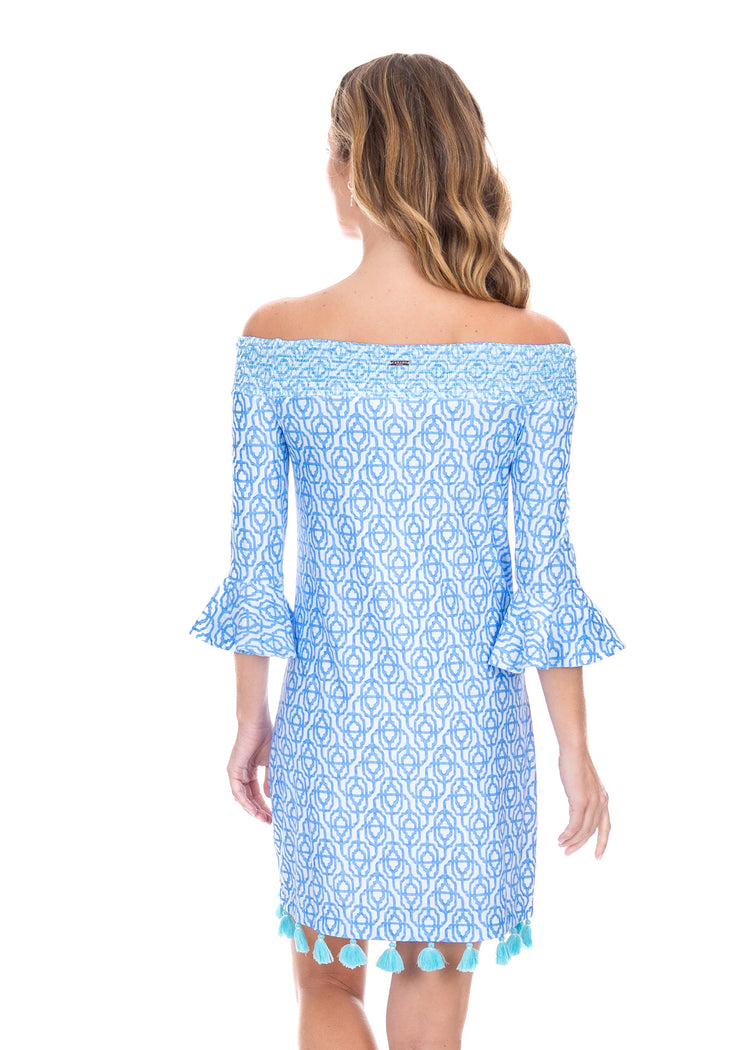 Back facing model wearing the Lake Como Off the Shoulder Dress with a white background. 