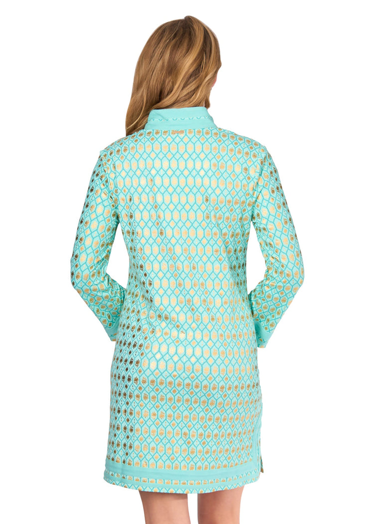 The back of a blonde woman wearing the Aqua Metallic Tunic Dress on a white background.