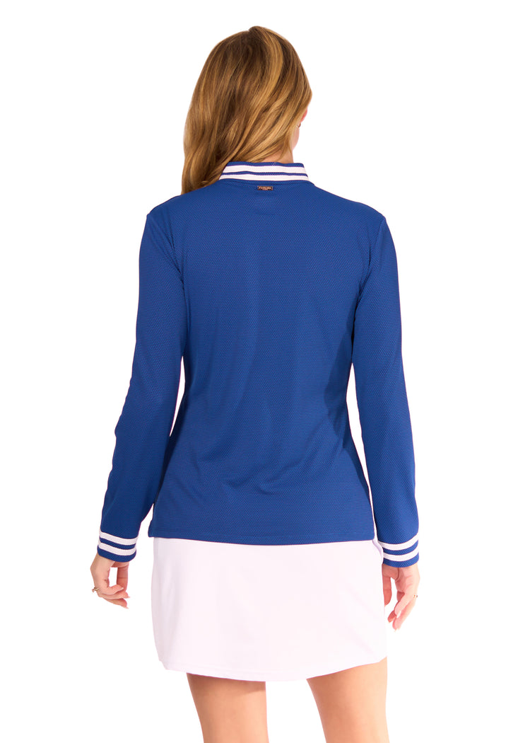 Back of Woman in Navy Collared Quarter Zip and White Skort