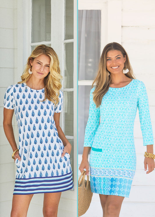 A split screen collage of blonde woman wearing the Cabana Life sun protective Delray Short Sleeve Shift Dress with her hands in pockets in front of a house and a brunette woman wearing the Coastal Cottage Cabana Shift Dress holding a purse in front of a white house.