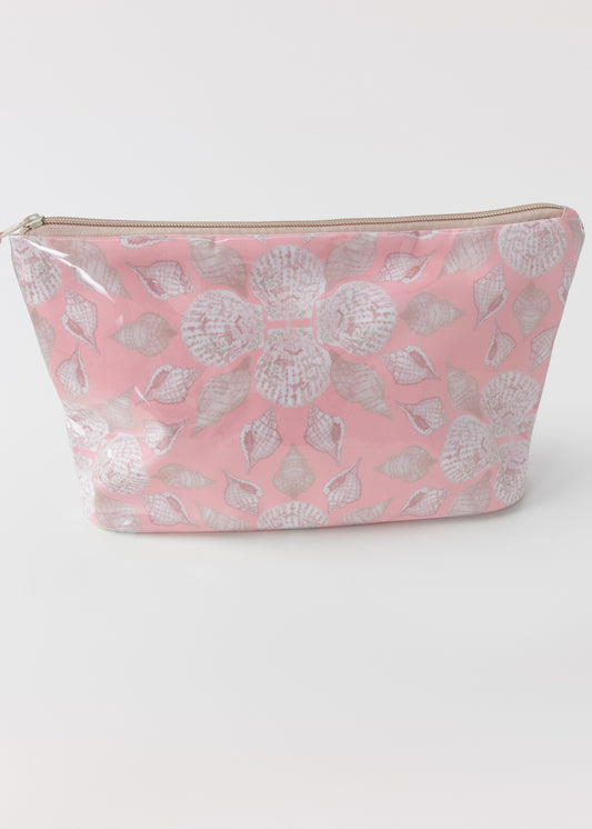 Pink accessory bag with seashell pattern on a white background