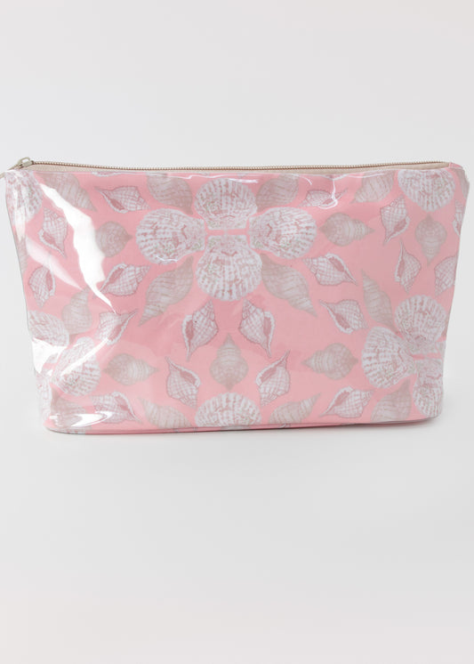 Pink accessory bag with seashell pattern on a white background