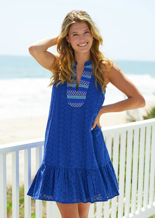 Woman wearing Navy Embroidered Eyelet Halter Dress on beach
