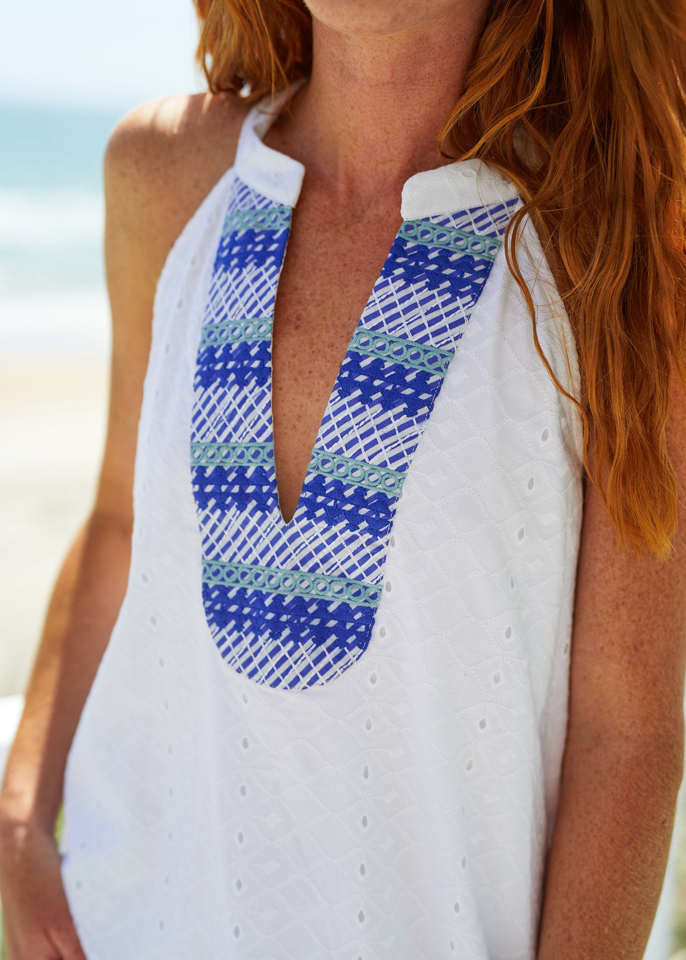 Woman wearing White Embroidered Eyelet Halter Dress 