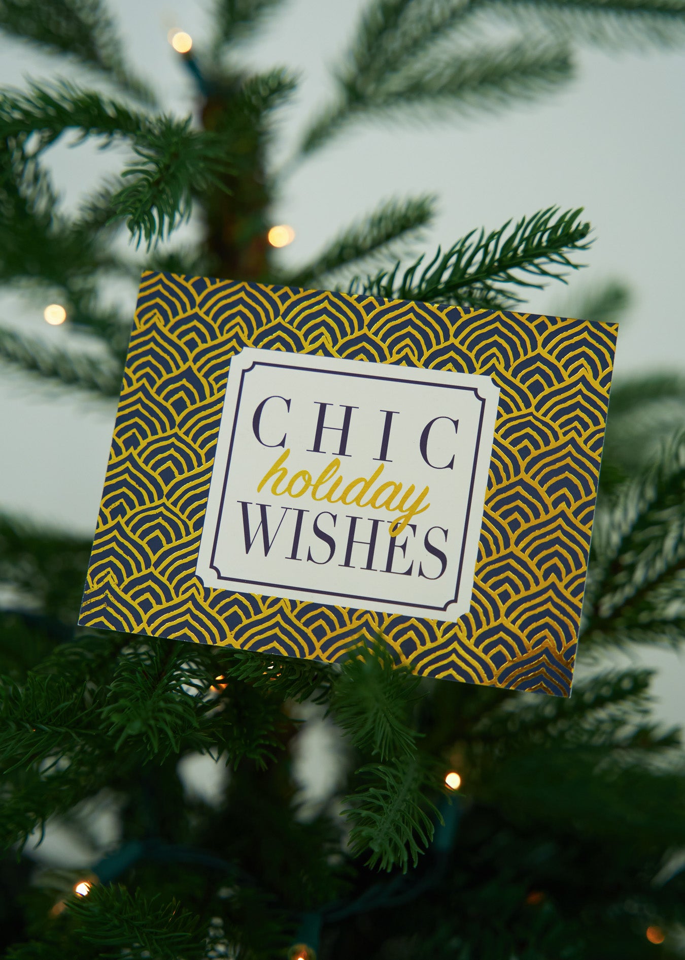 Chic Holiday Wishes Card on Christmas Tree