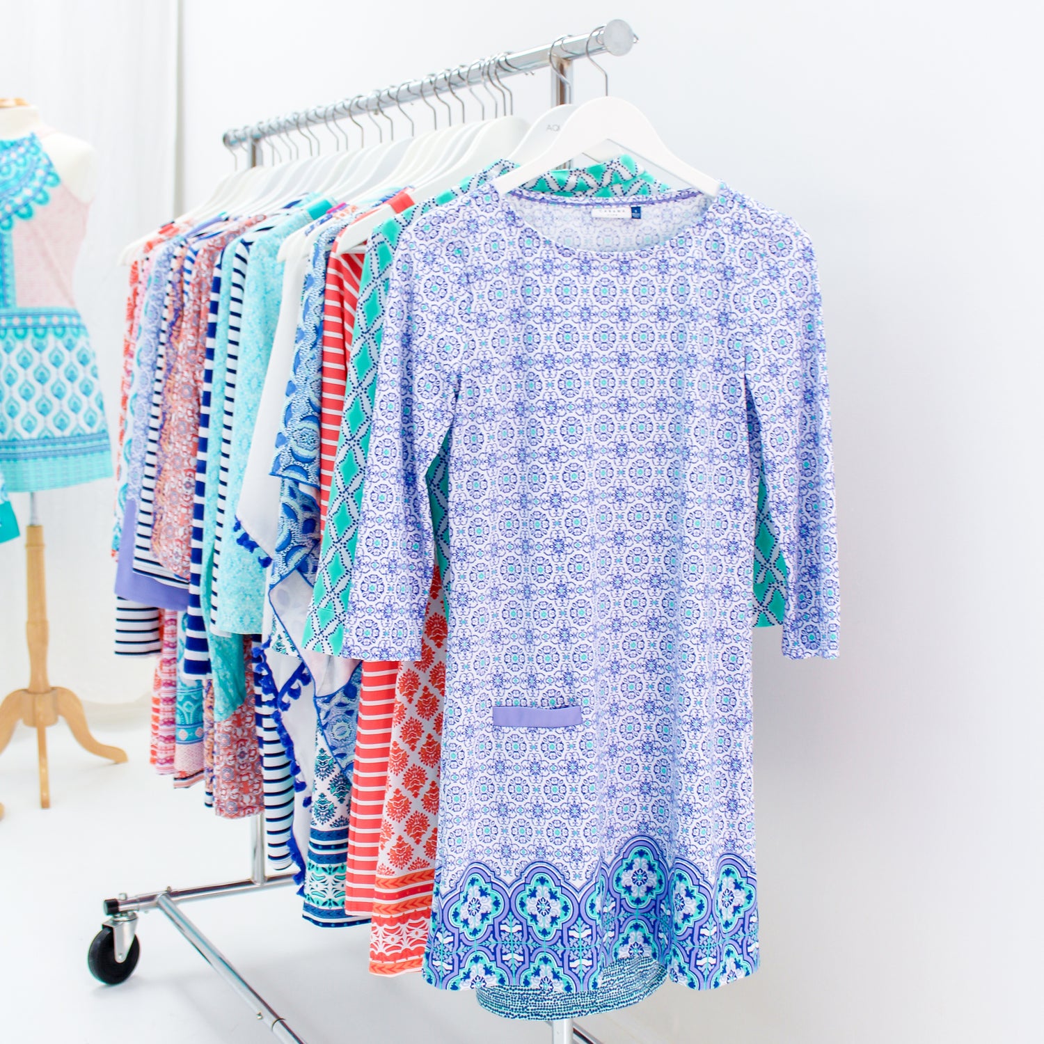 Cabana Life dresses on rolling rack in purple, blue, orange