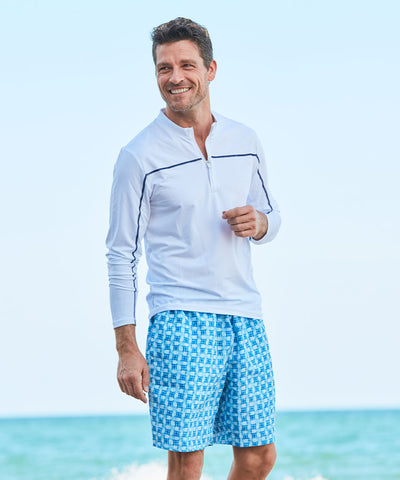Man wearing White Sport Zip Top & Windermere Reversible Swim Trunks.