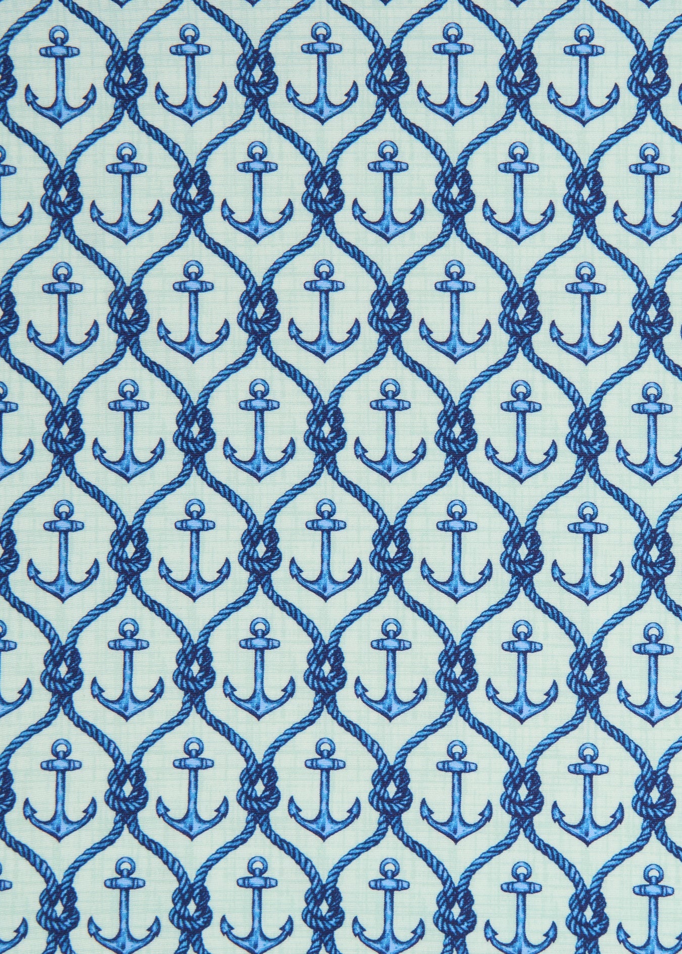 A fabric close-up of a blue print on the Cabana Life sun protective Anchor Sleeveless Tie Waist Dress.