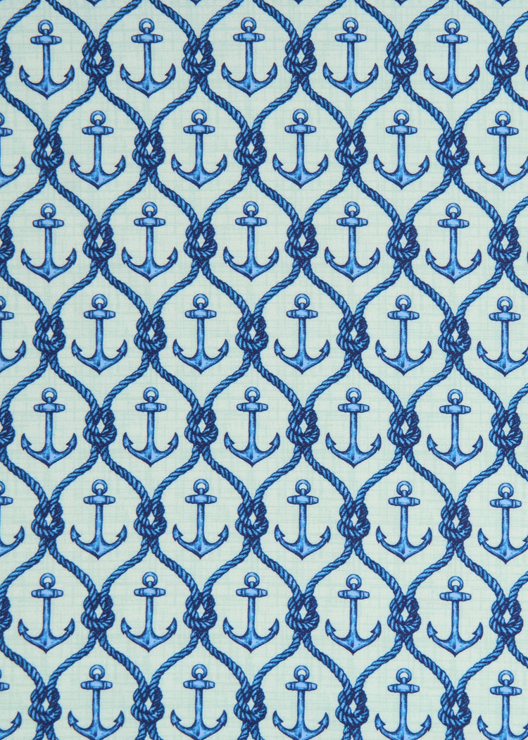 A fabric close-up of a blue print on the Cabana Life sun protective Anchor Sleeveless Tie Waist Dress.
