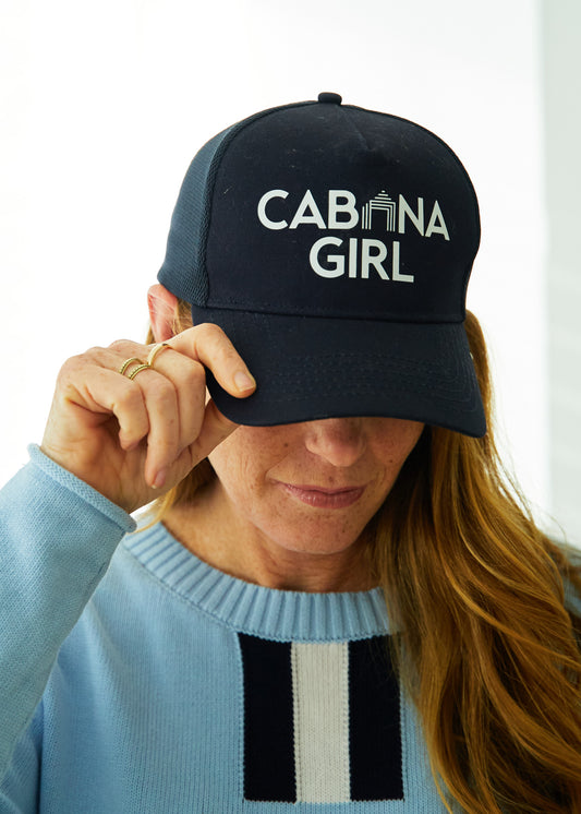 Woman wearing Cabana Girl Hat and Light Blue and Navy/White Stripe Sweater.