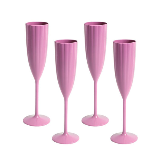 Four pink champagne flutes on a white background