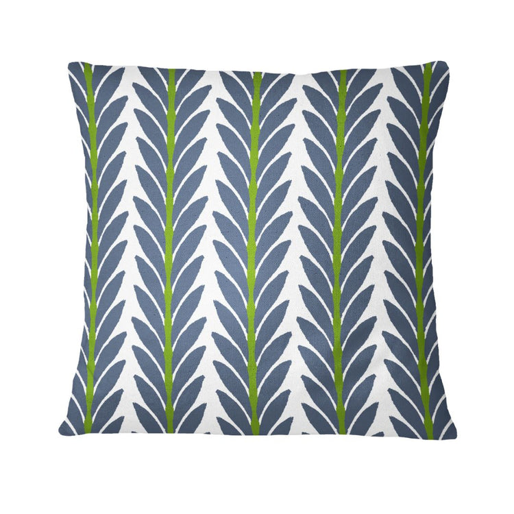 Decorative pillow with blue and green leaf pattern on a white background