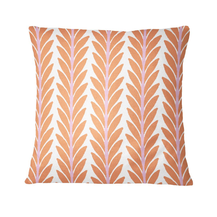 Decorative pillow with a leaf pattern on a white background