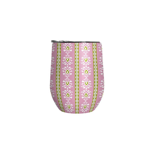 Pink tumbler with green and white pattern on a white background