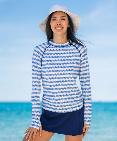 Woman wearing sun protective Cabana Life rashguard and swimskirt