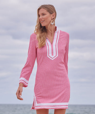 Woman wearing Amelia Island Pique Tunic Dress on a beach.