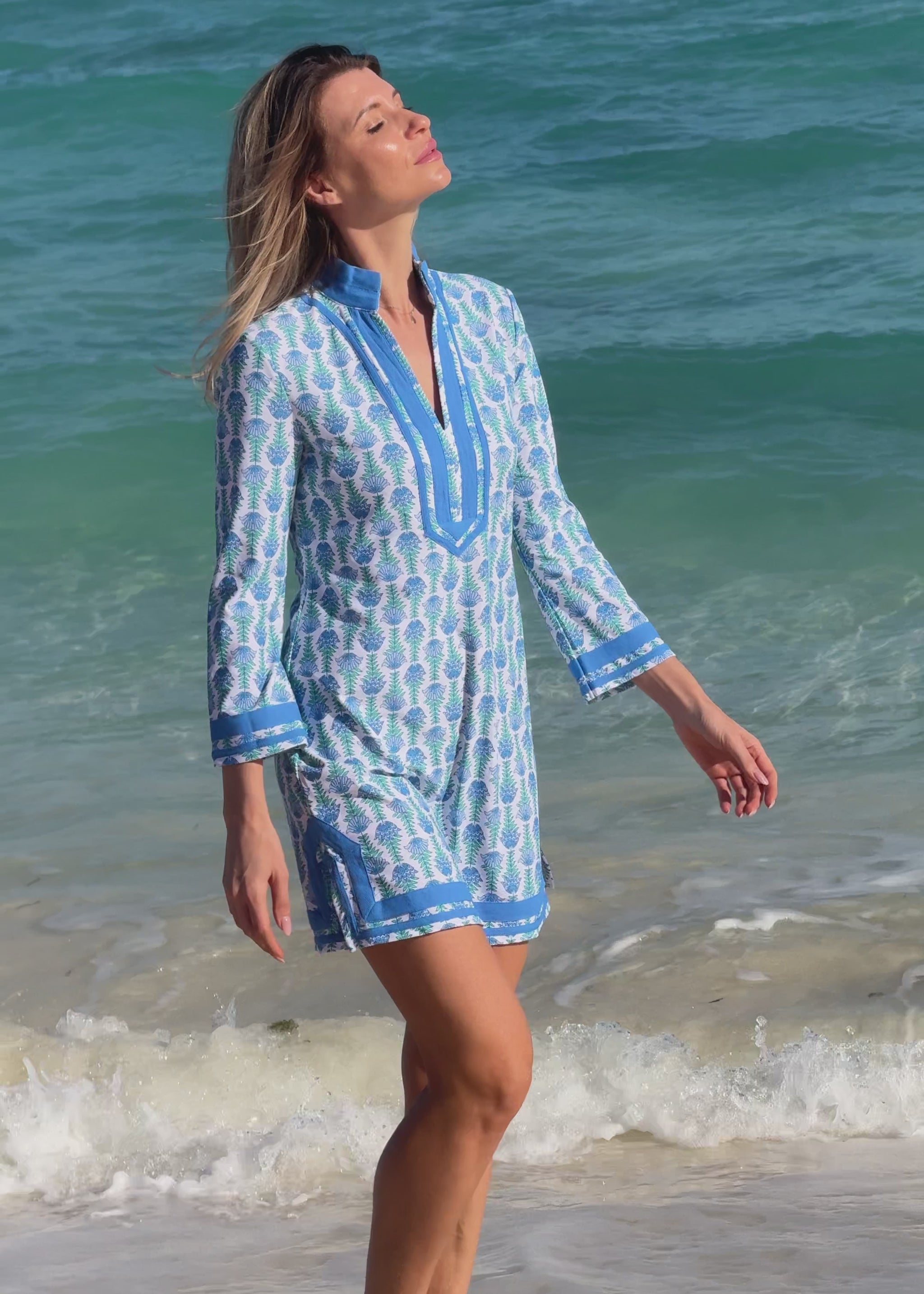 Woman wearing a blue and white patterned dress 