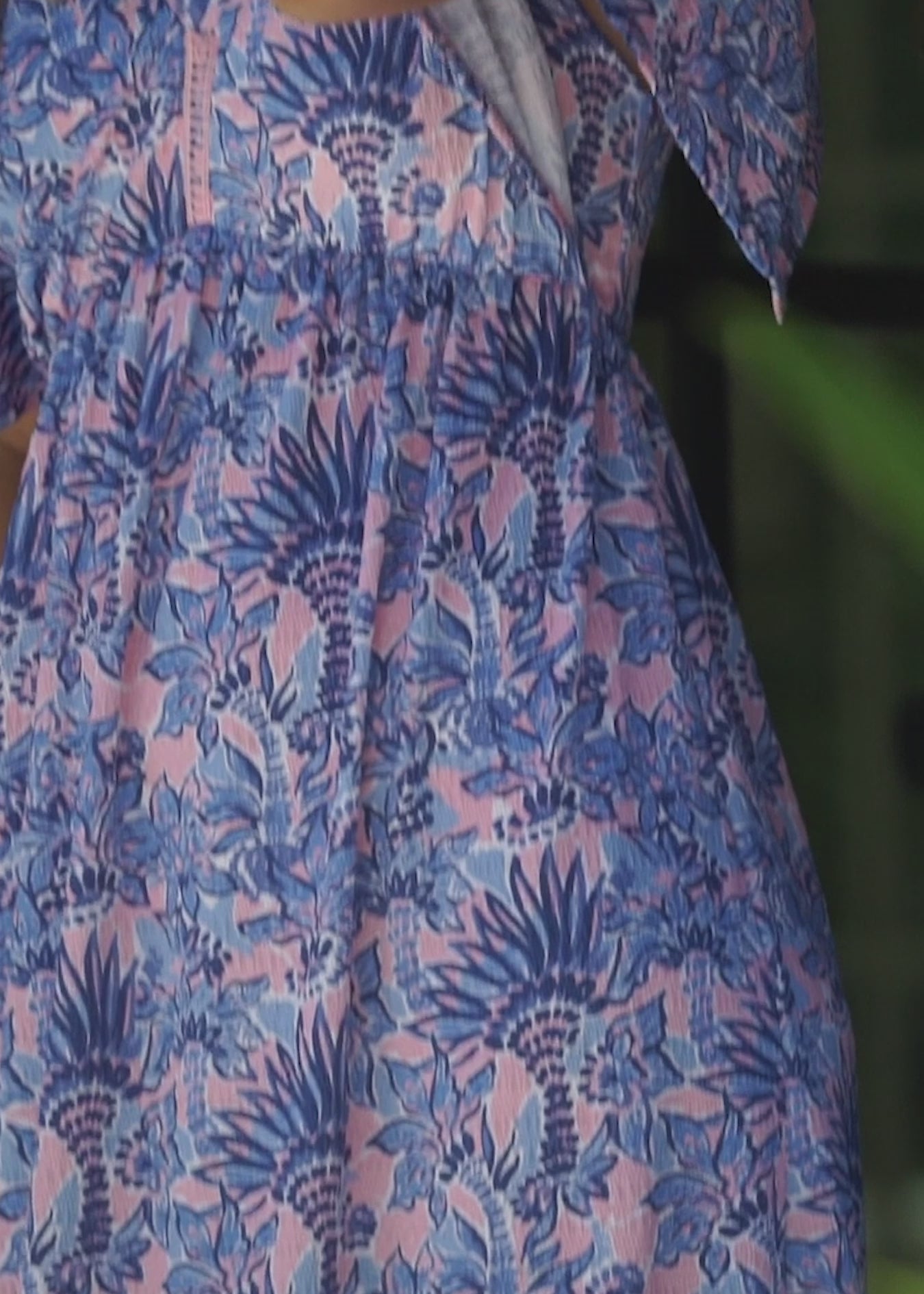 A blonde woman wearing the Cabana Life sun protective & flowy Palm Beach Flutter Sleeve Maxi Dress.
