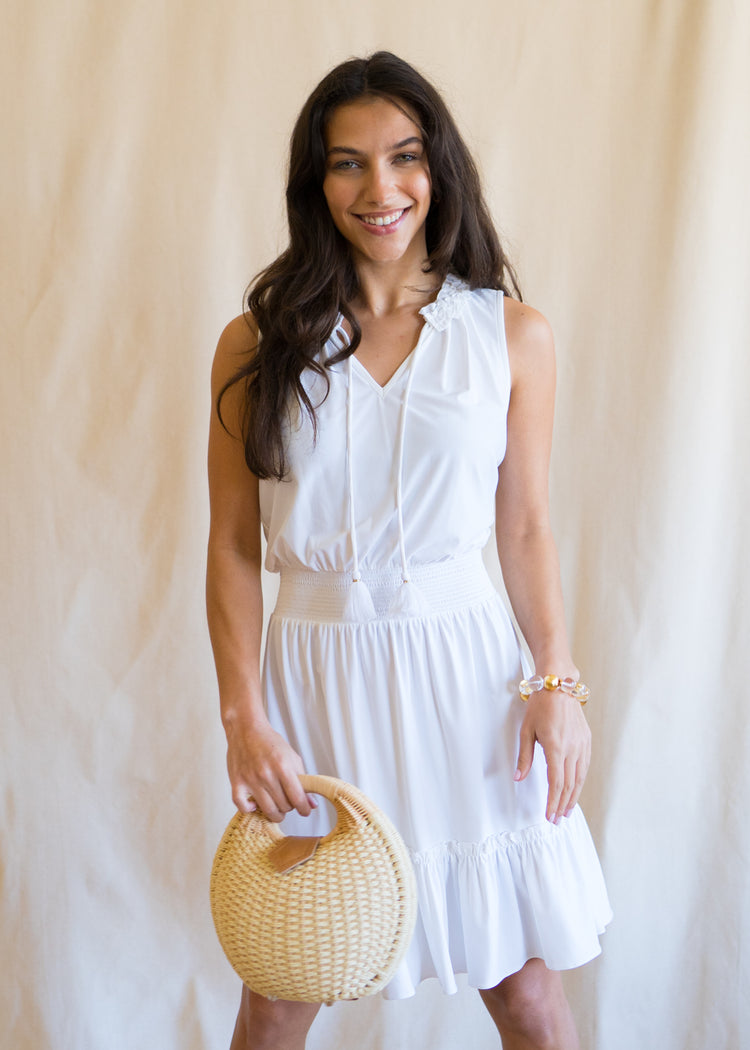 Woman wearing White Sleeveless Ruffle Dress