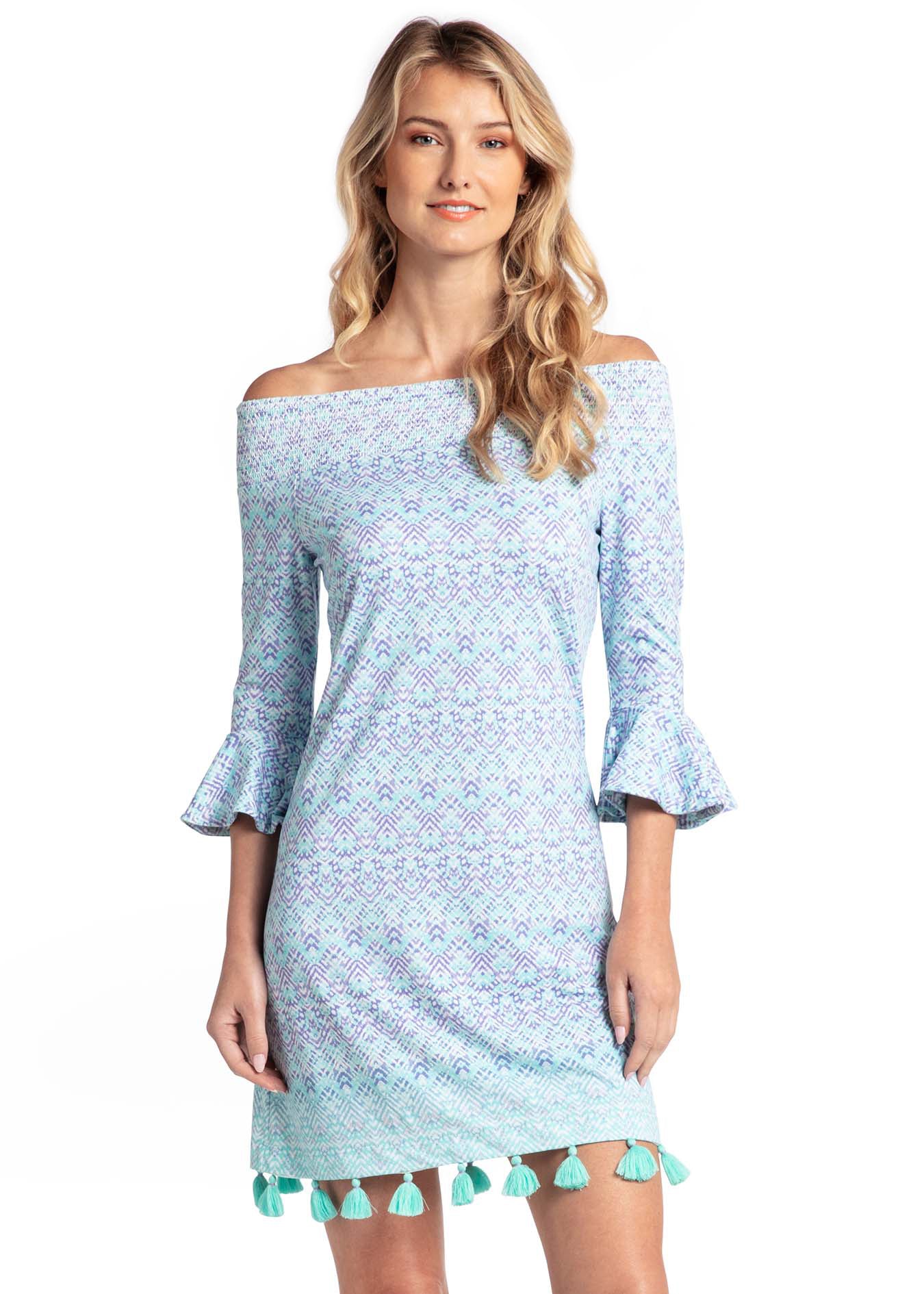 Woman wearing Naples off the shoulder dress.