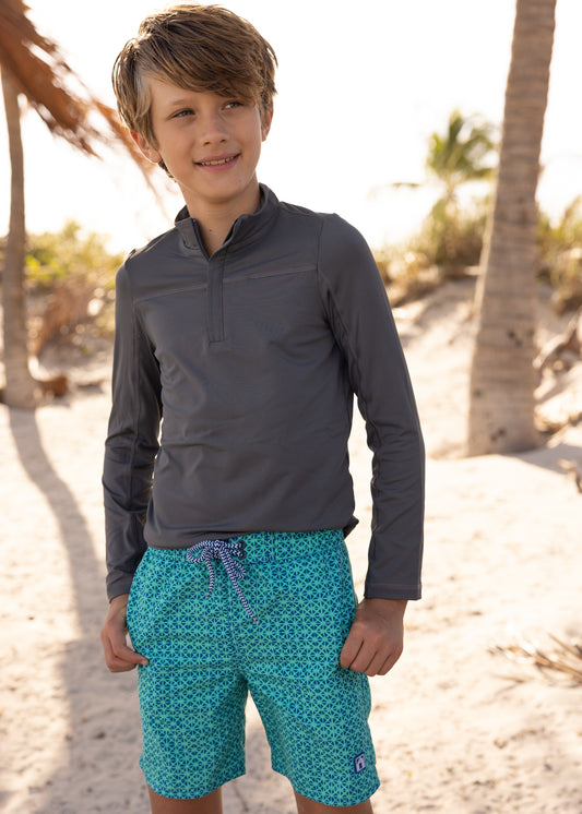 Boy wearing Boys Grey Sport Zip Top and Boys Sag Harbor Swim Trunks