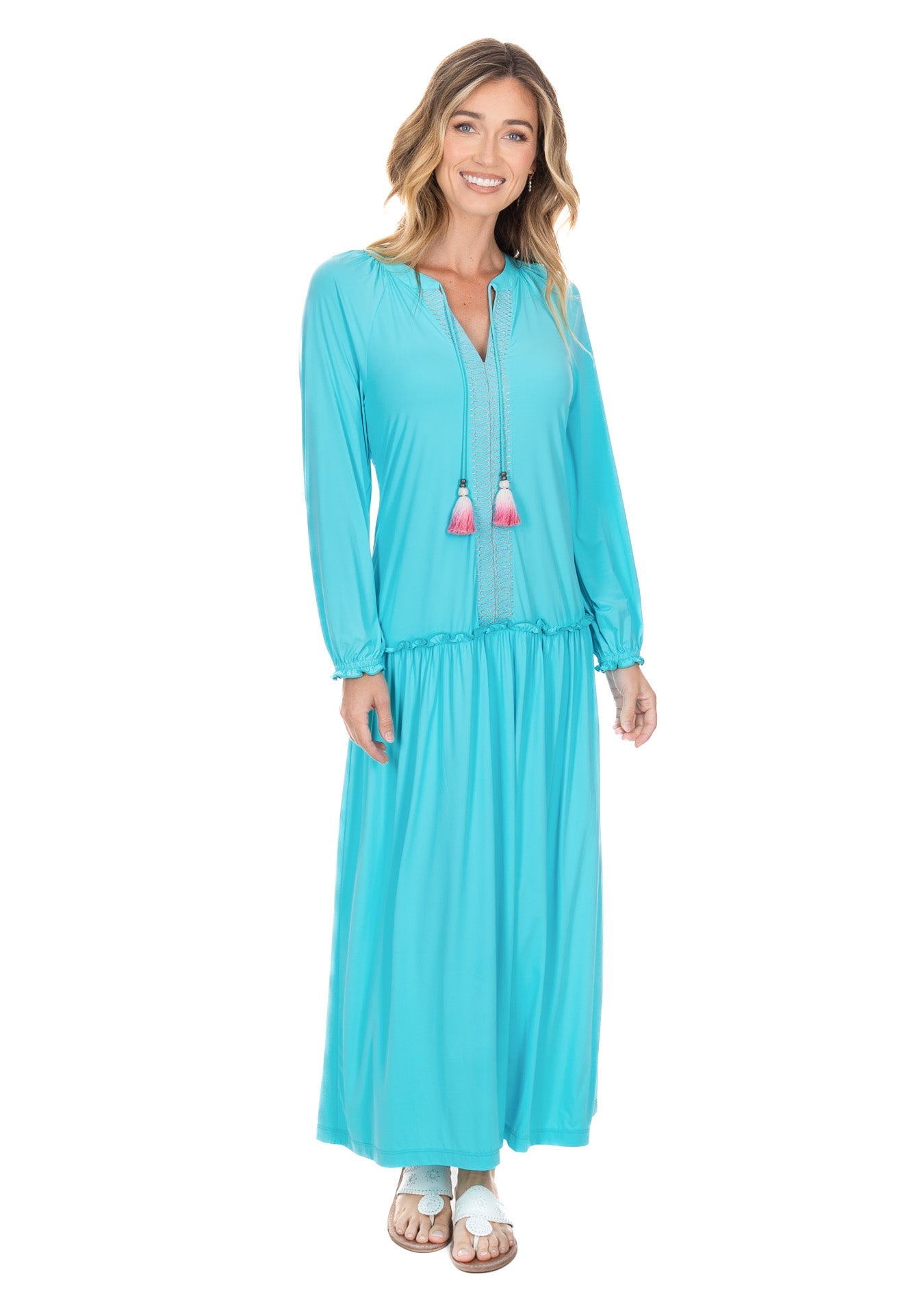 A studio shot of a woman wearing the flowing UPF50+ Cabana Life Aqua Embroidered Tunic Maxi Dress. 