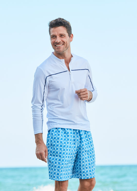 Man wearing Windermere Reversible Swim Trunks and White Performance Top.