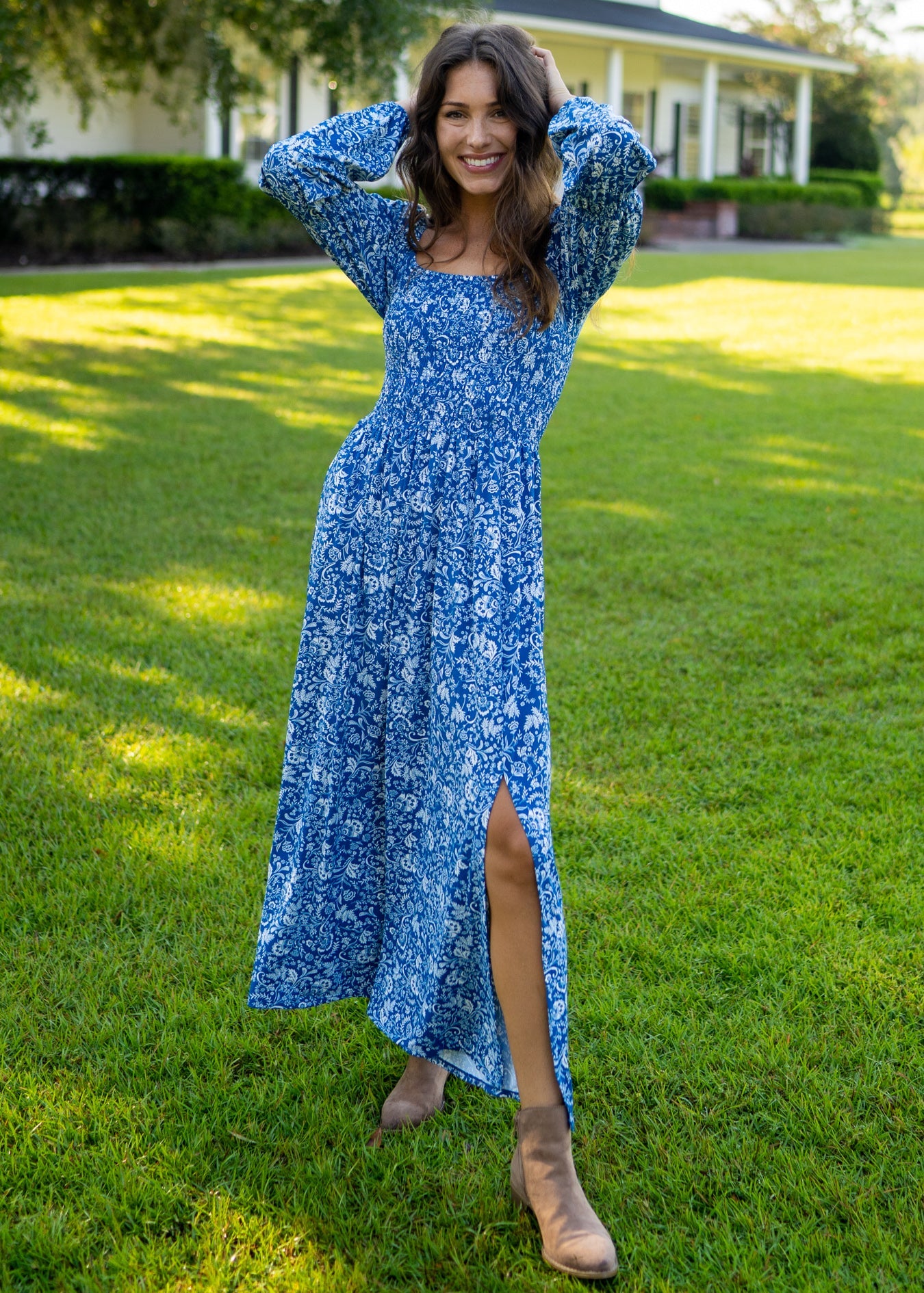 Woman wearing Aspen Puff Sleeve Smocked Maxi Dress with booties