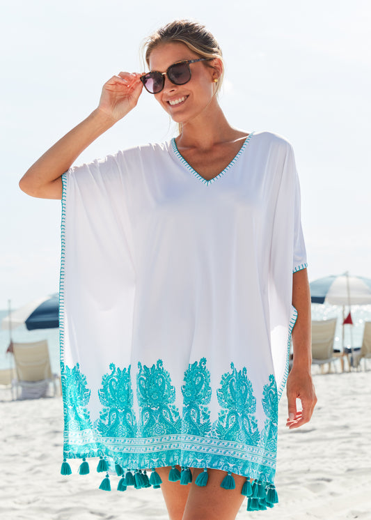 Woman standing on the beach wearing St. Pete Embroidered Cover Up.