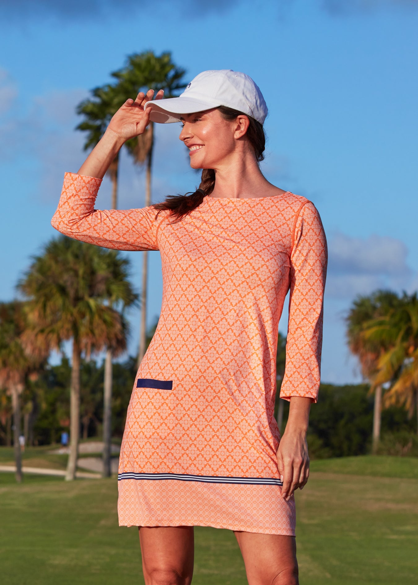 Woman on golf course wearing Fisher Island Cabana Shift Dress.