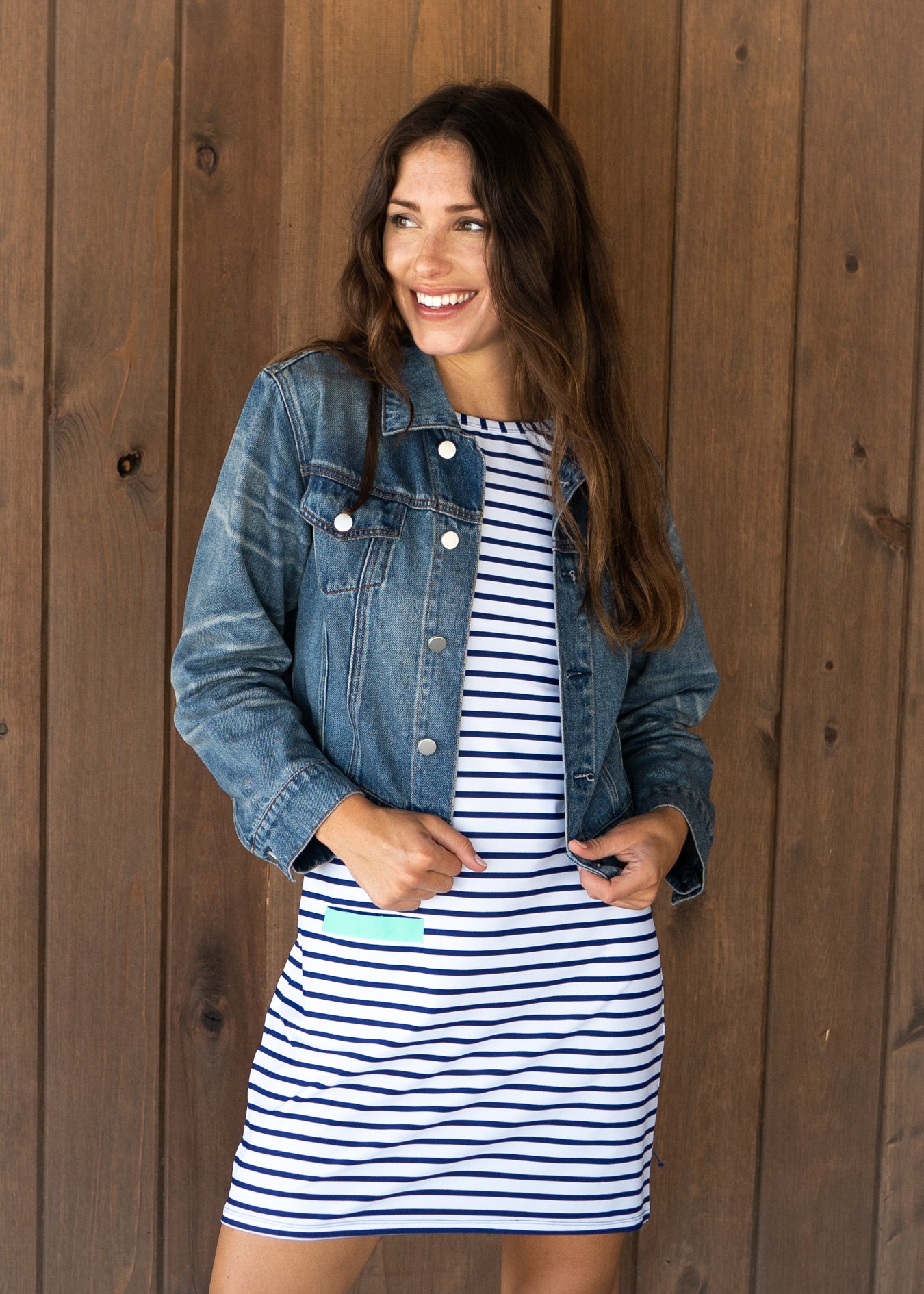 Woman wearing Navy Stripe Cabana Shift Dress and jean jacket