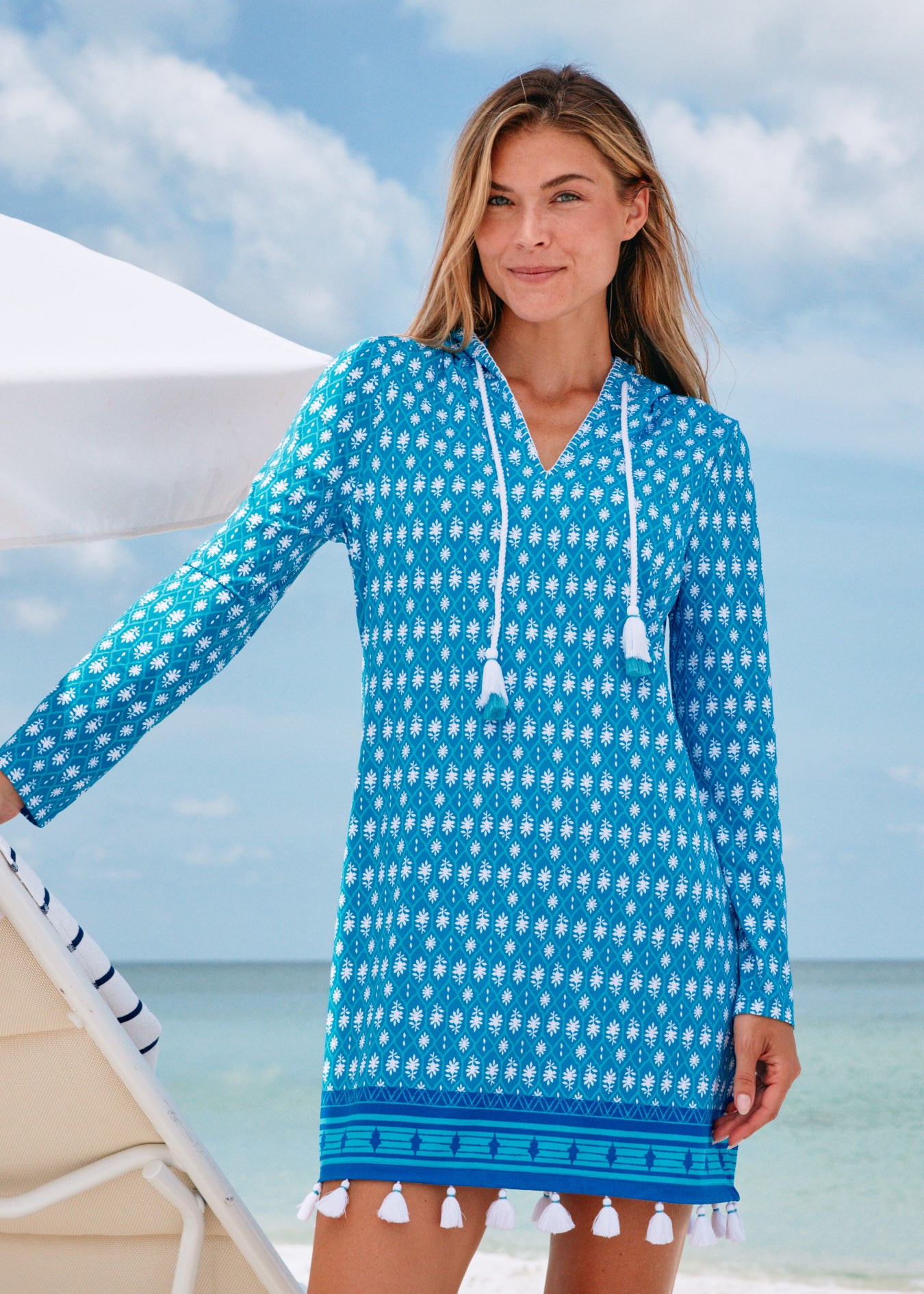 Woman on beach wearing Palm Valley Hooded Cover Up.