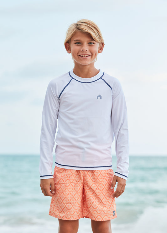 Boy wearing Fisher Island Swim Trunks.