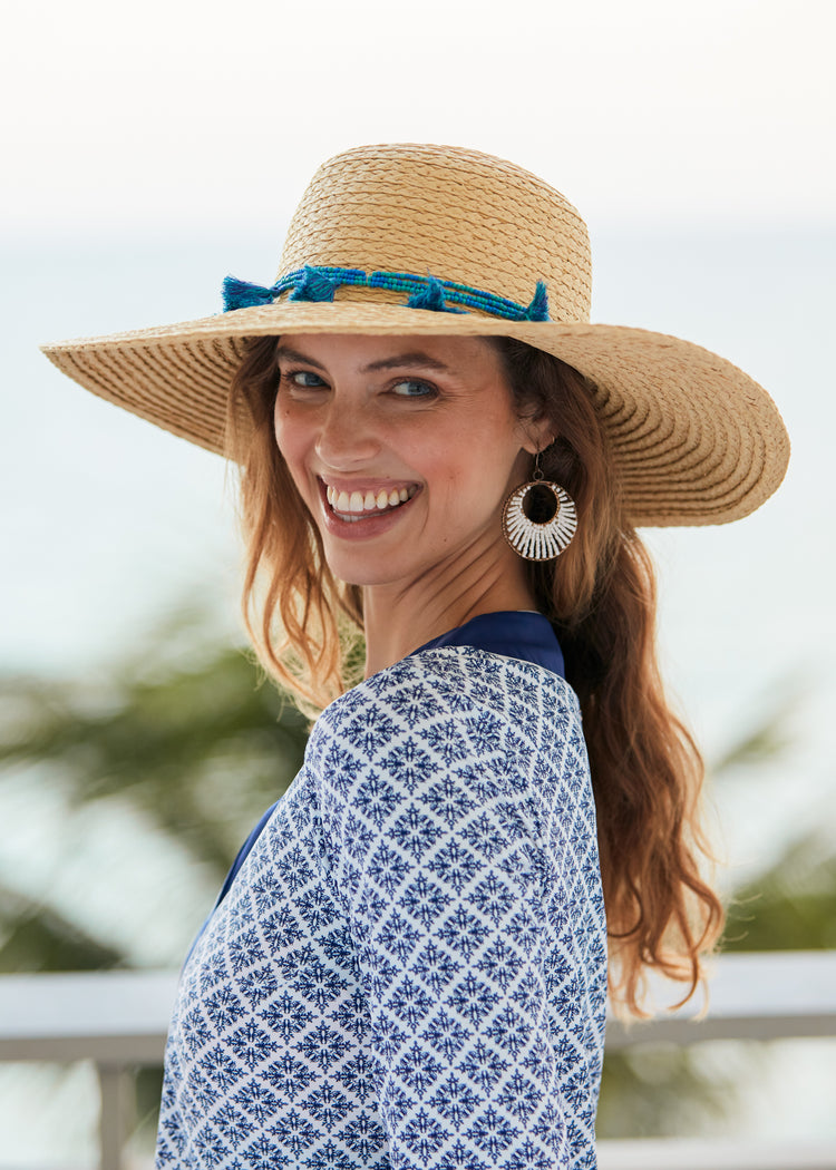 Woman wearing Tan Wide Brim Sun Hat.