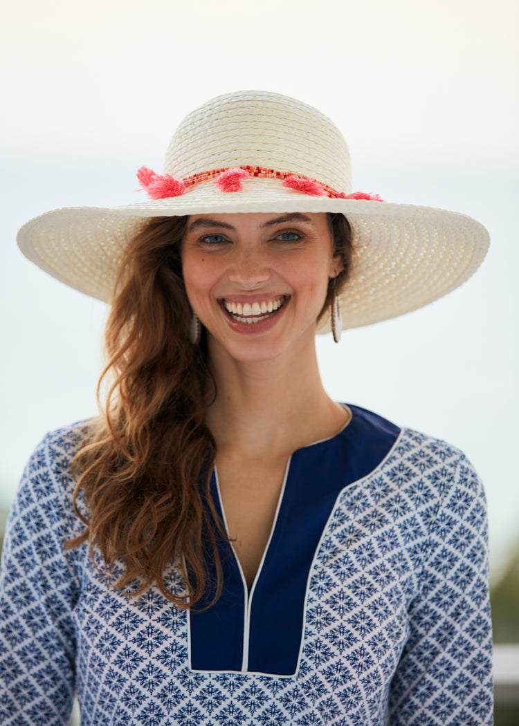 Woman wearing White Wide Brim Sun Hat.