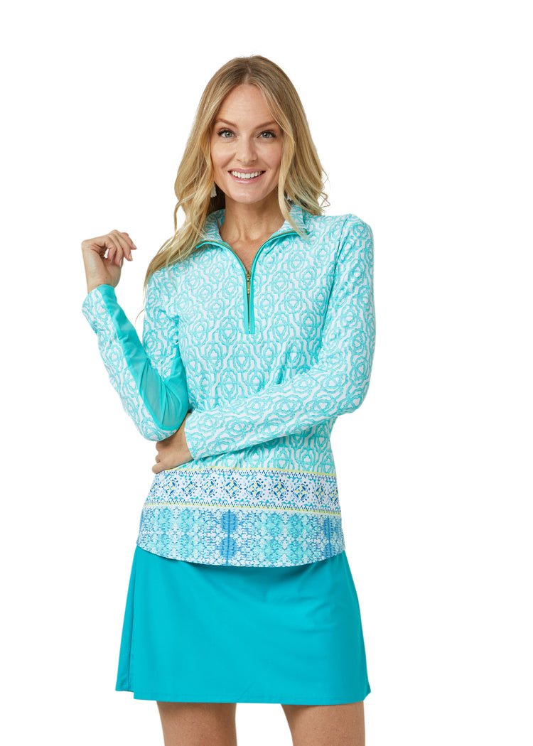 Woman wearing Coastal Cottage UPF 50+ Wicking Performance Zip Top and Turquoise Longer Swim Skirt