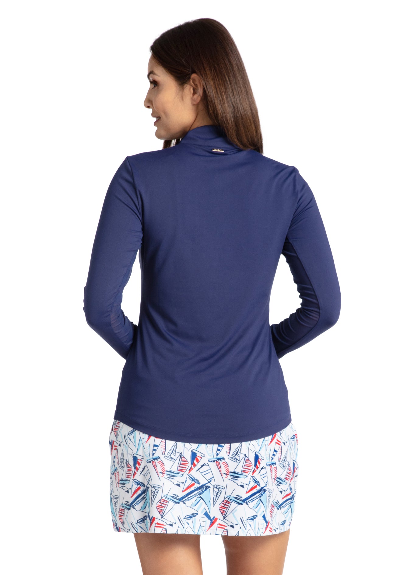 Woman modeling back of Sailboat Medium Length Skort and Navy Sport Zip Polo on boat.
